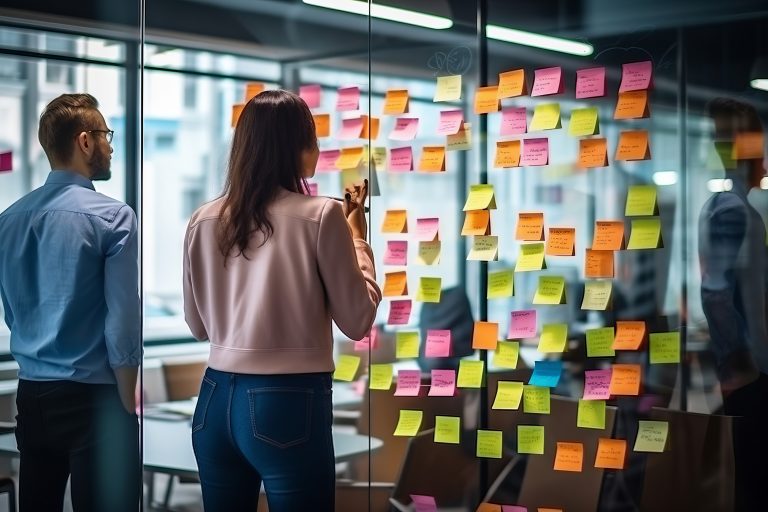 Creative people, thinking and meeting for schedule planning, brainstorming or team strategy at the office. Man and woman in teamwork decision for project plan