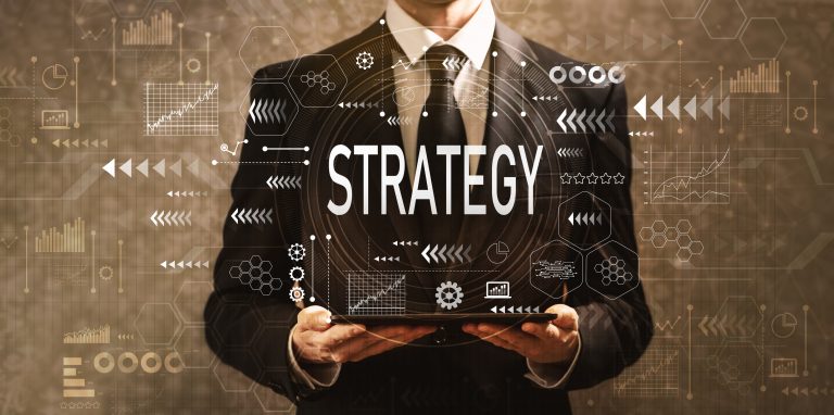 Strategy with businessman holding a tablet computer